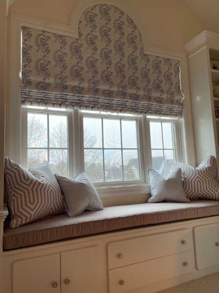 Custom arched Roman shade engineered to complement unique window shape