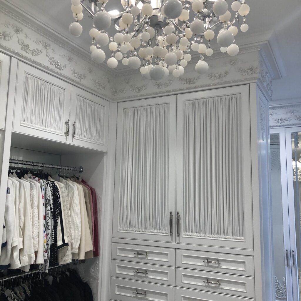 Cabinet panels seamlessly blend in with the room while concealing the inner contents.