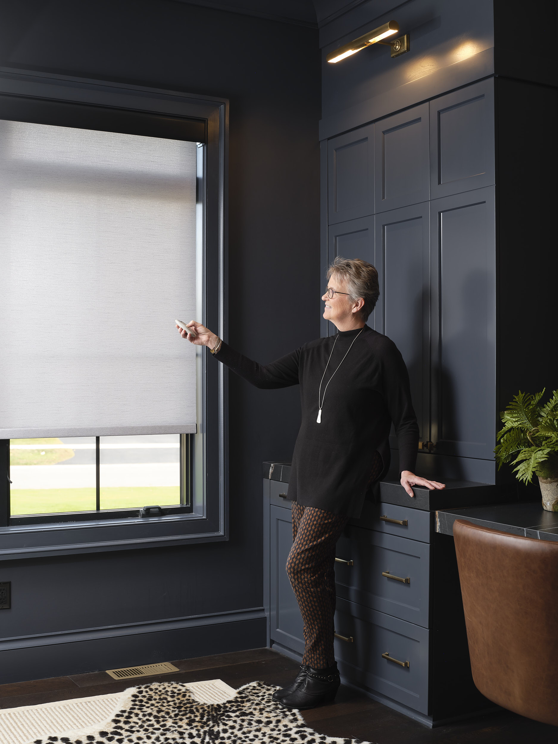 A motorized shade in use, requiring only a press of a button.
