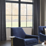 Stationary panels with a motorized roller shade.
